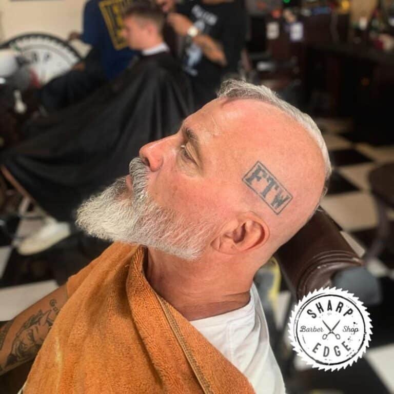 A client receiving a Holiday Haircut Seminyak at Sharp Edge Barber, ready for the festive season.